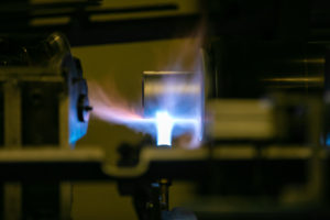 Heating up a tube for roller manufacturing.